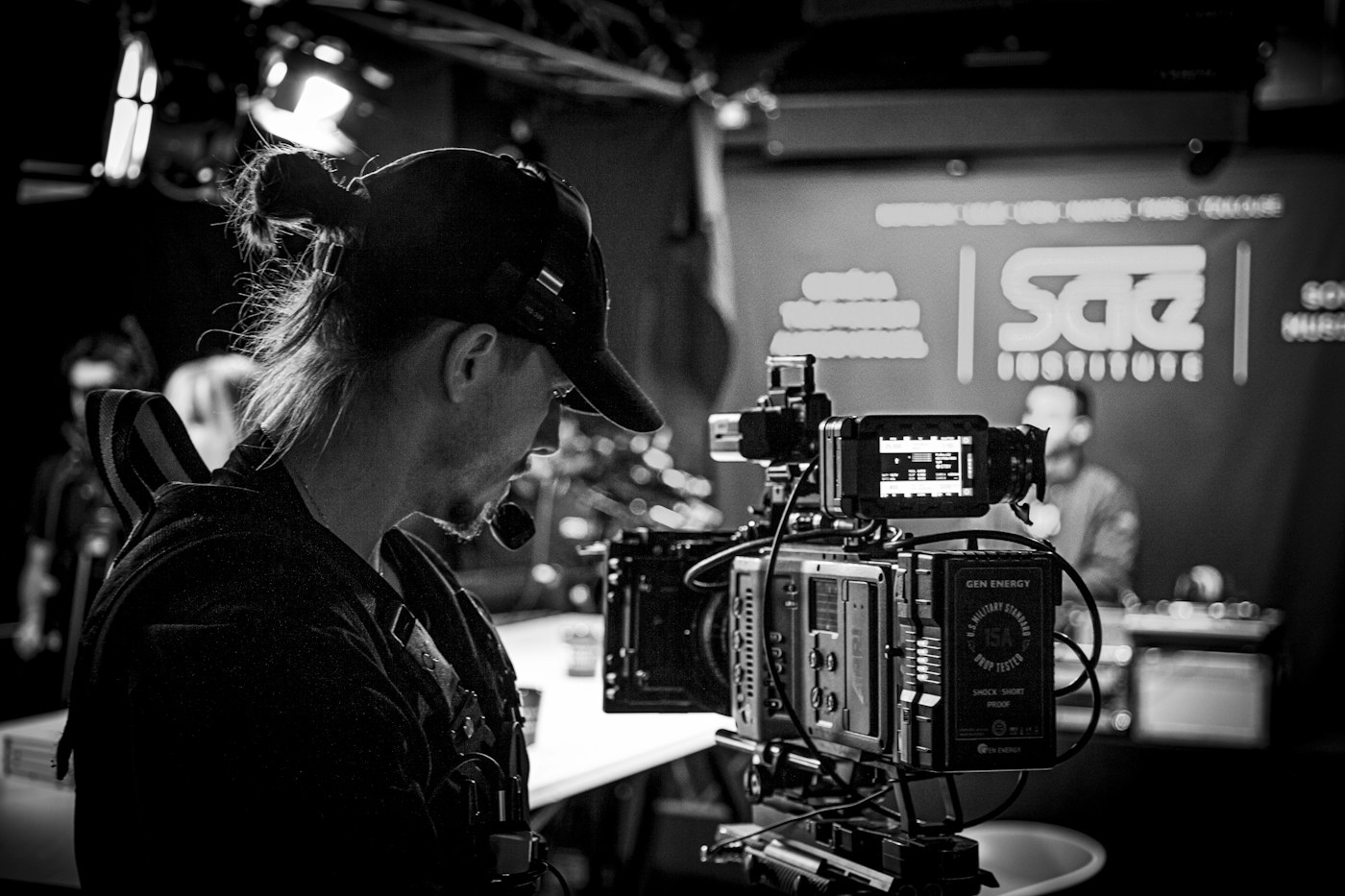 A camera operator recording with professional production equipment